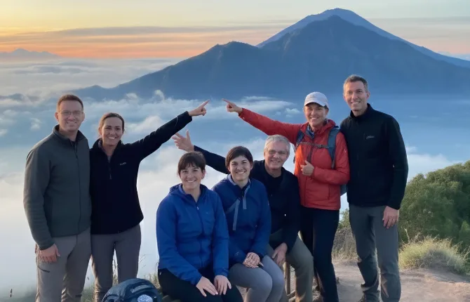 Hiking group at Mount Batur summit at sunrise